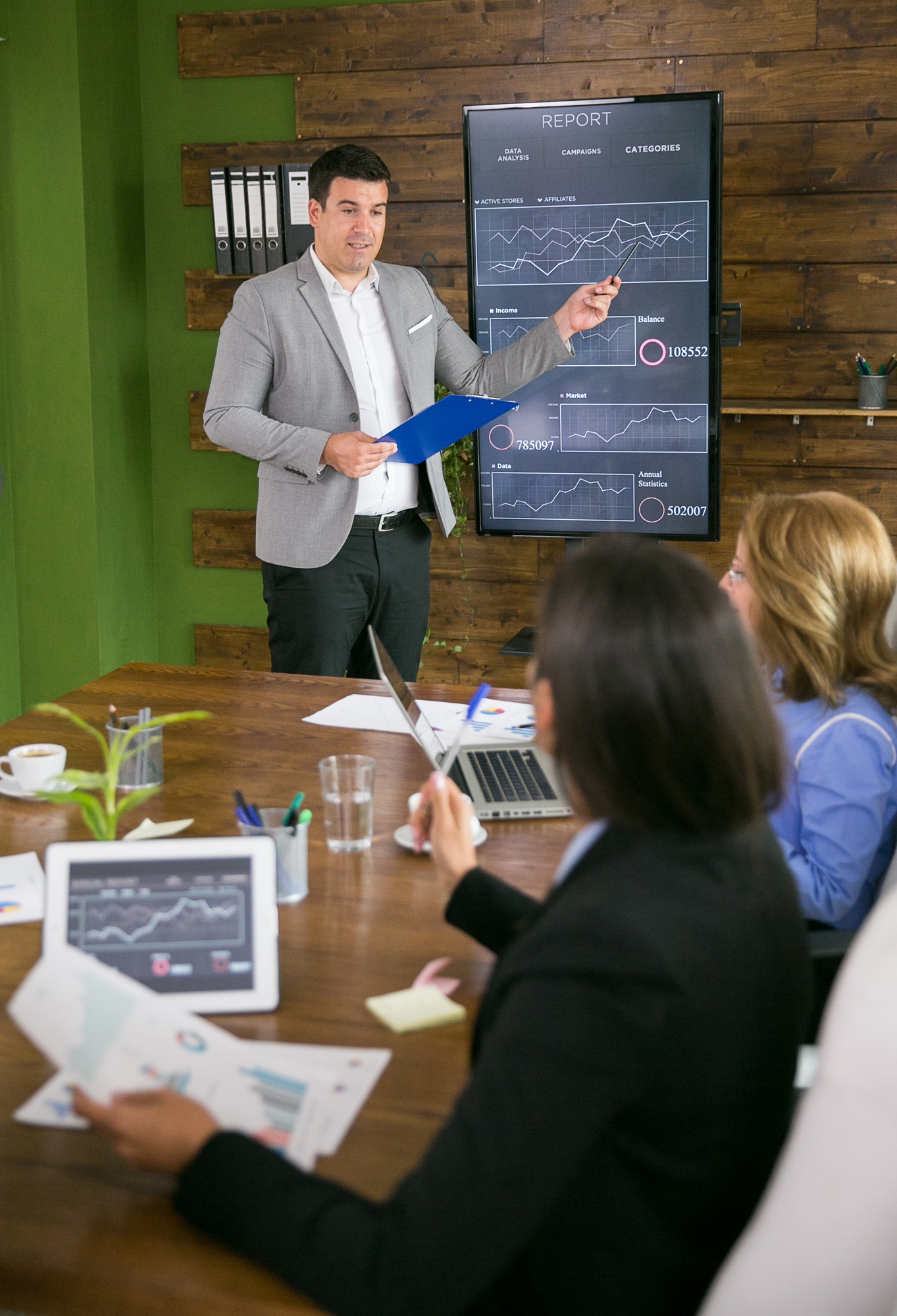 Young businessman presenting in front of leadership